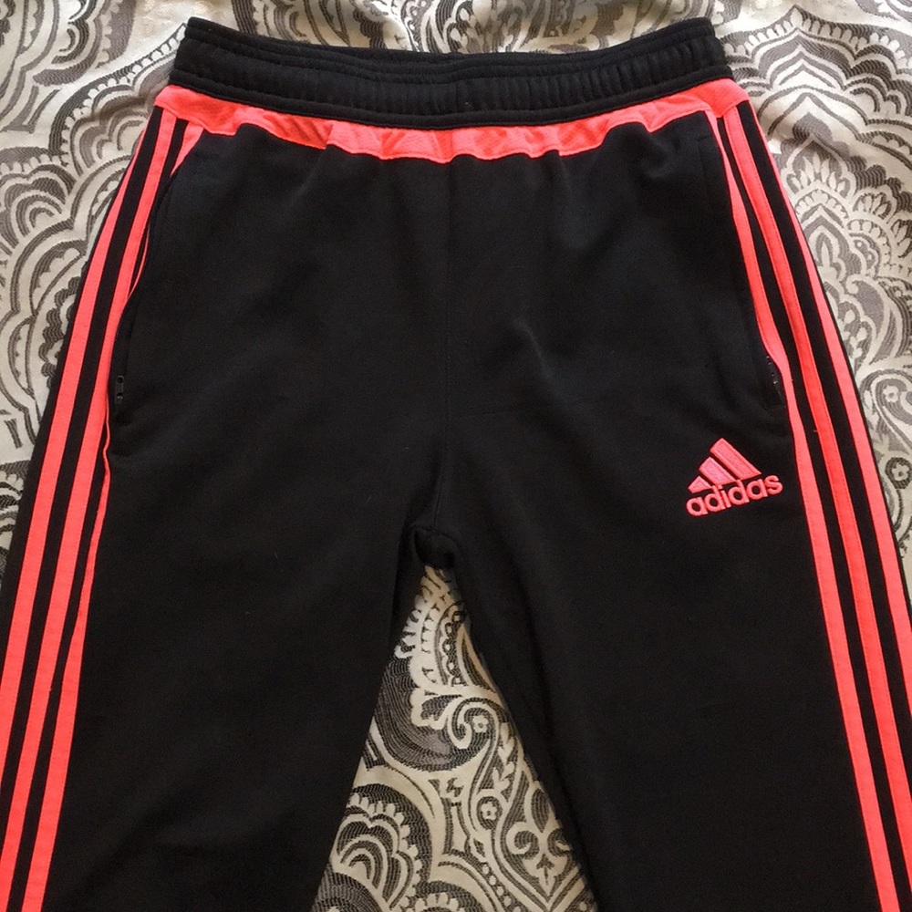 Black and neon pink adidas joggers